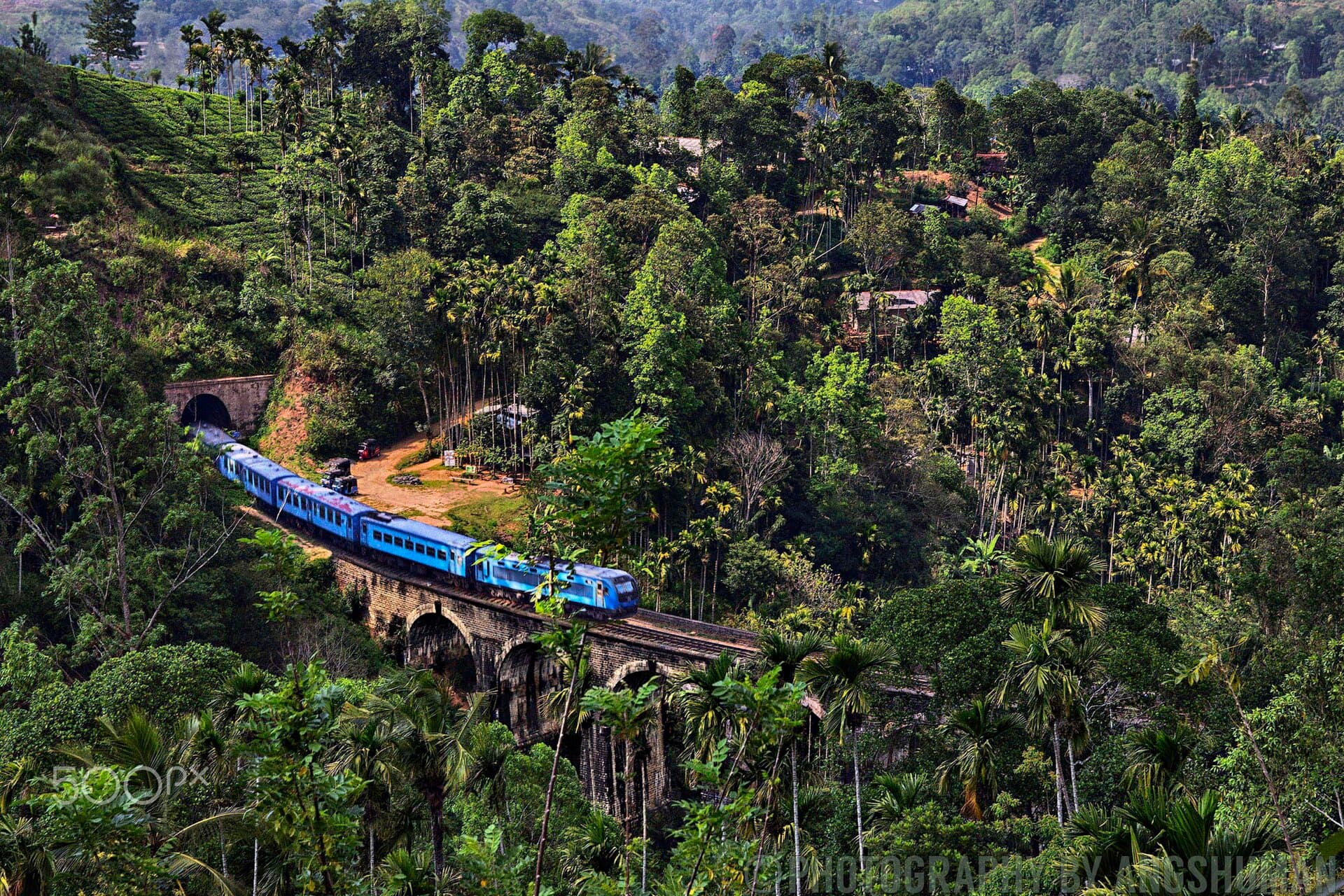 A train crossing the Nine Arch Bridge near Ella, Sri Lanka