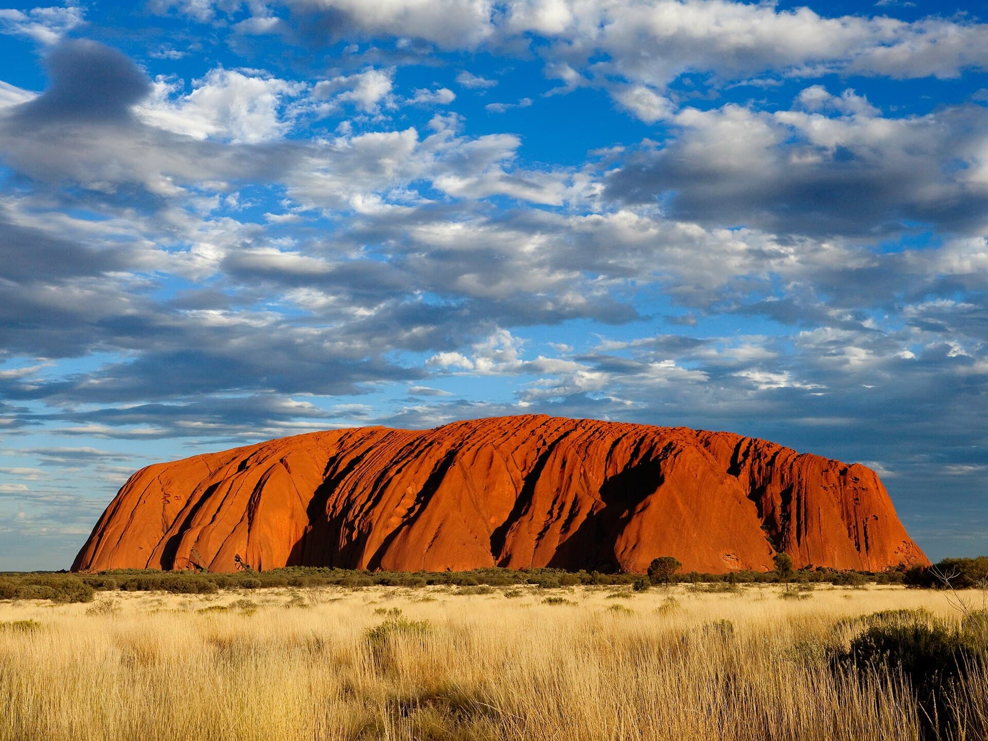 Uluru glowing red at sunset in the Australian outback