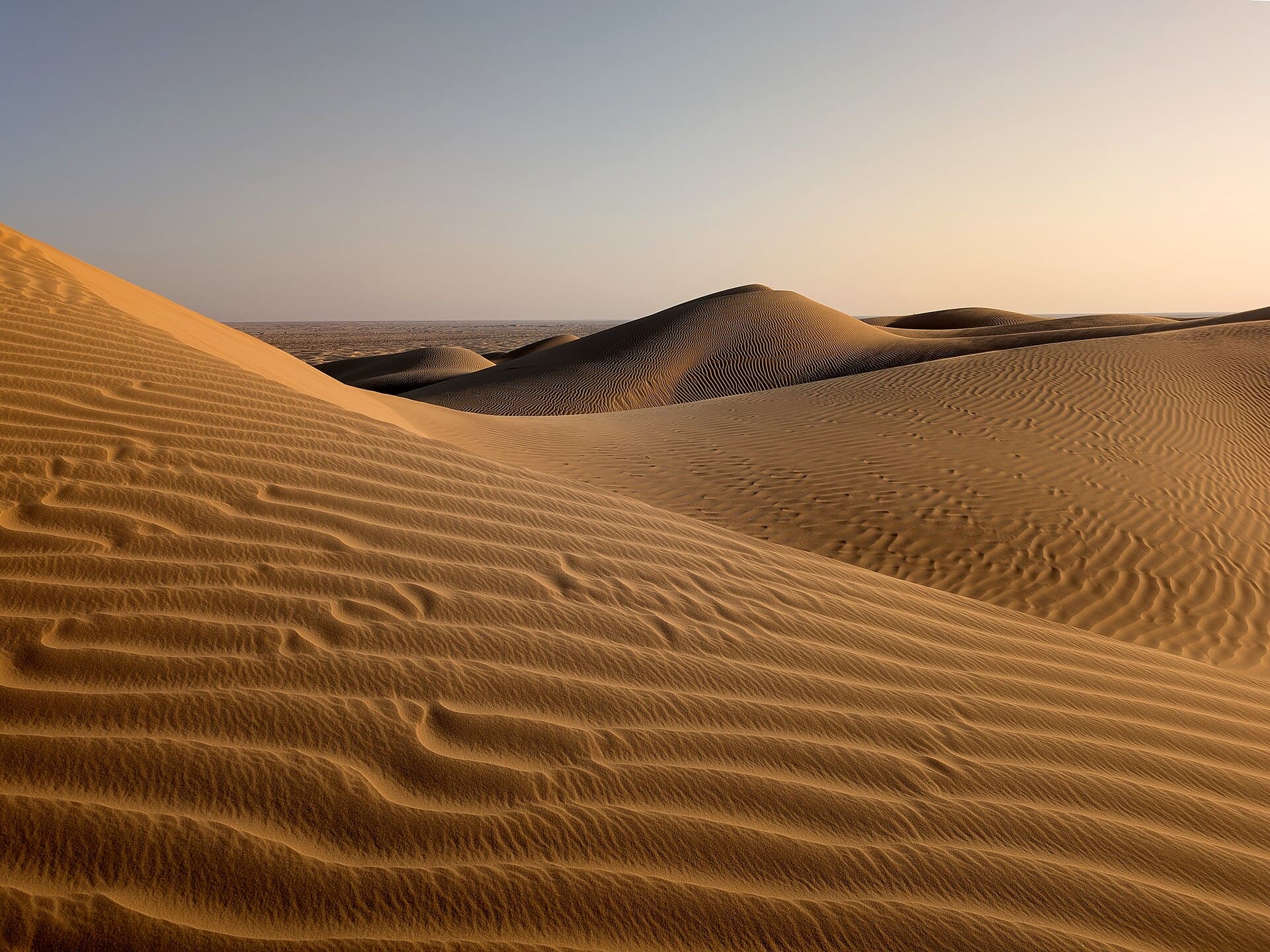 Rolling red sand dunes of the Arabian desert near Dubai