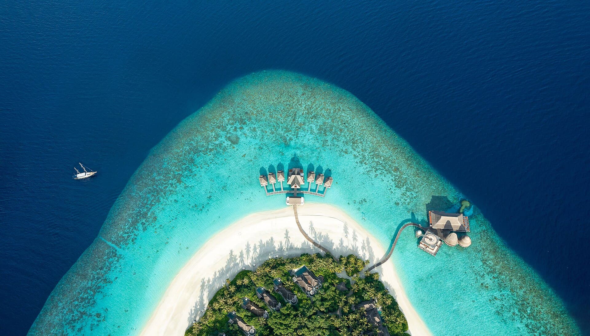 Aerial view of a Maldives island and turquoise lagoon