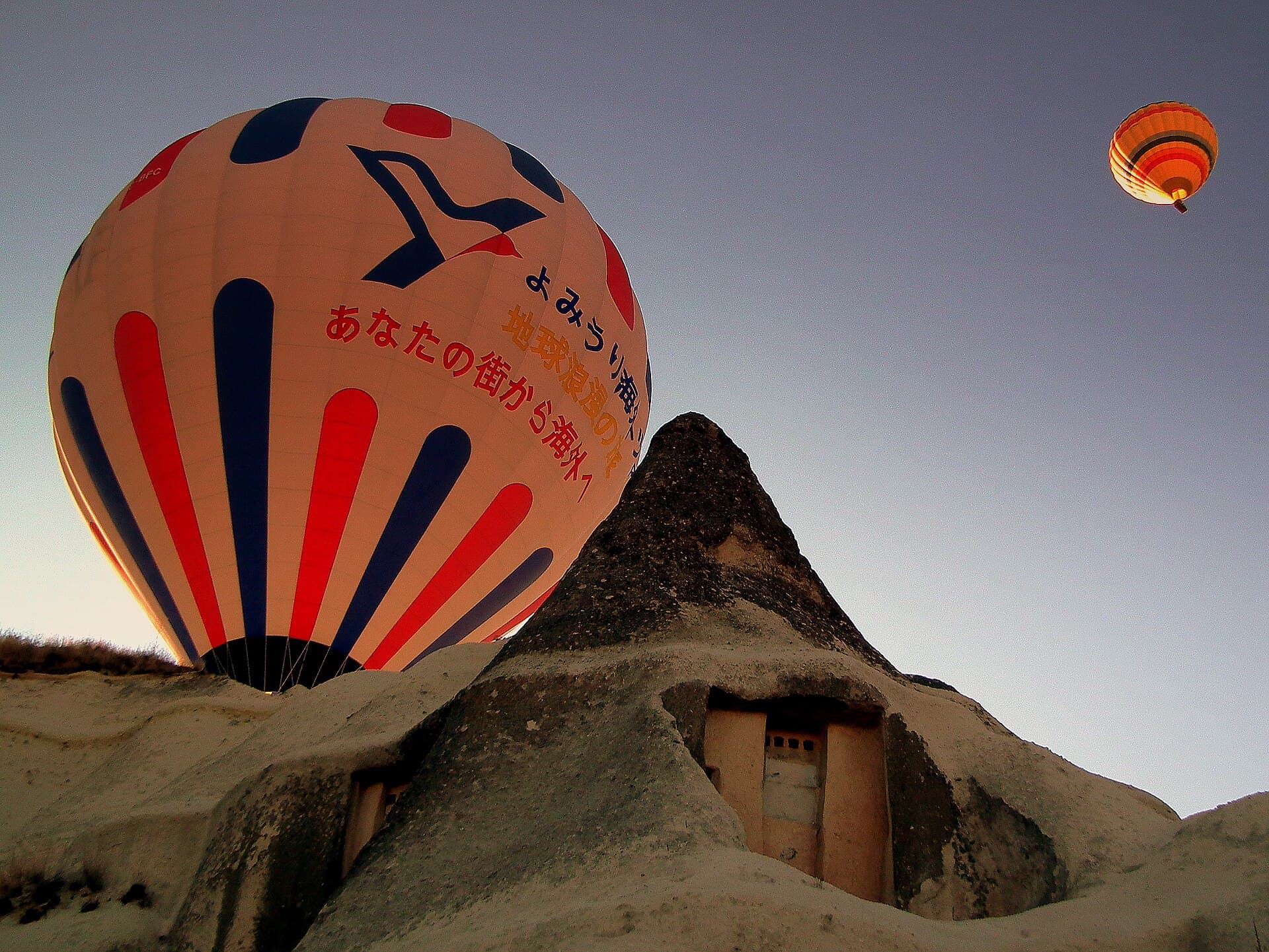 Hot air balloons over the valleys of Cappadocia at sunrise, Turkey